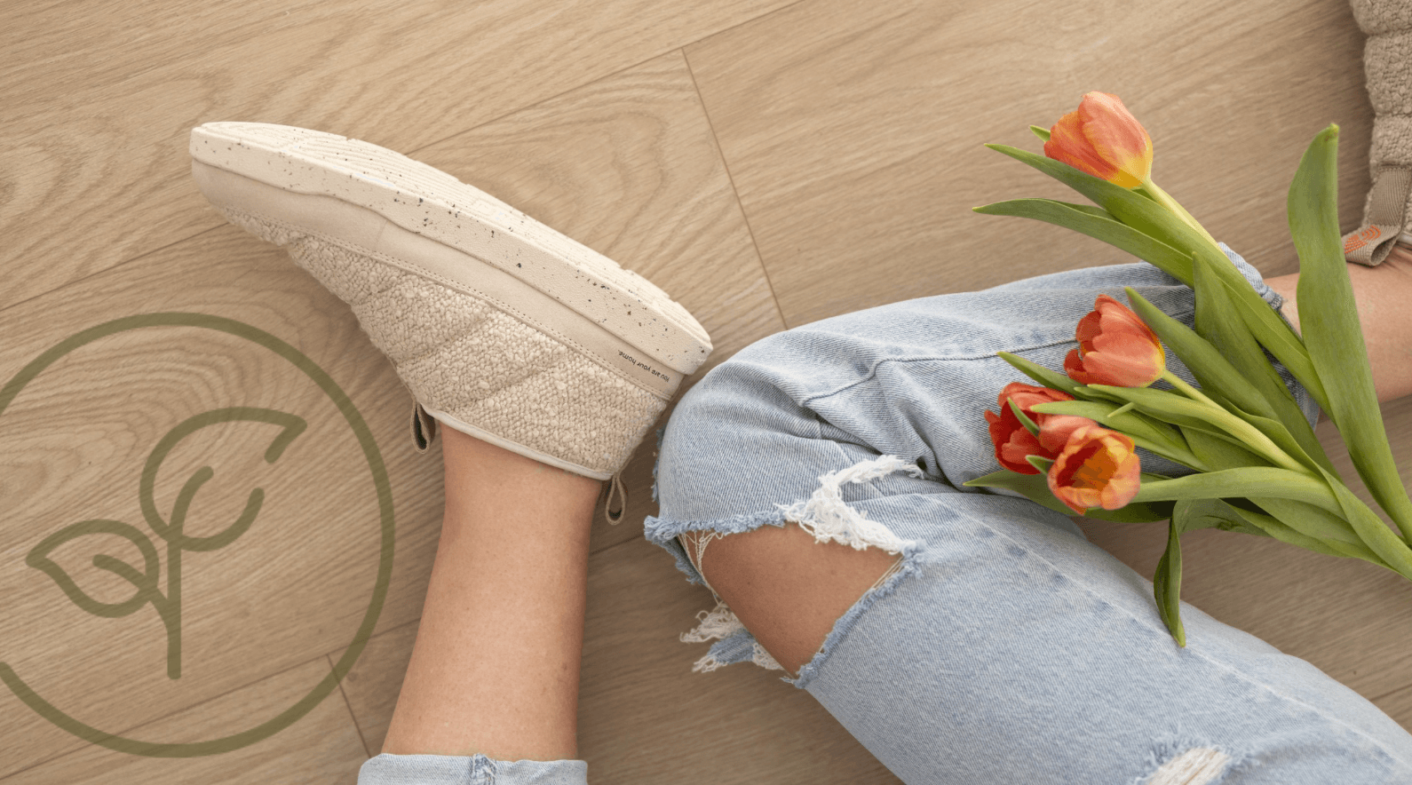 Slippers worn with a pair of jeans